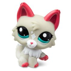 littlest pet shop white cat with blue eyes and pink ears sitting on the ground