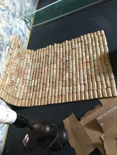 a cork mat is laying on the floor next to a lamp