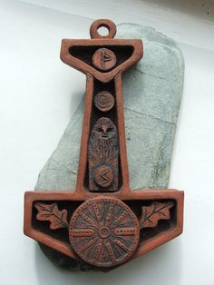 an iron cross is sitting on top of a rock