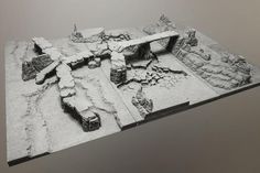 a black and white photo of rocks and snow