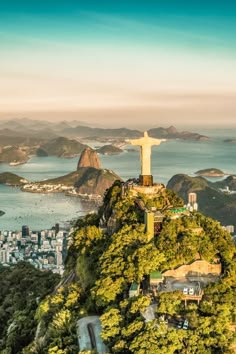 an aerial view of the statue of christ on top of a hill in rio, brazil