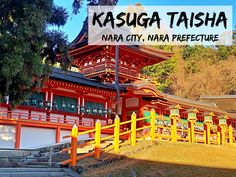 a red and yellow building with the words kasuga taisha over it