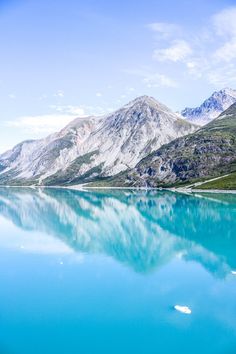 blue water with mountains in the background
