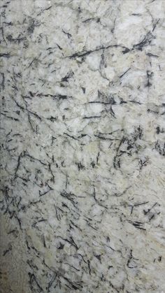 a marble counter top with black and white streaks on it's surface is shown