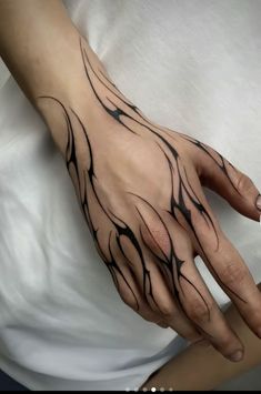 a woman's hand with black lines on it