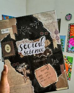 someone is holding up a book with the words social stimee written on it