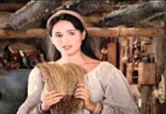 a woman holding a basket in her hands