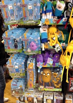 there are many toys for sale on the shelves in this store, including spongebob and other cartoon characters
