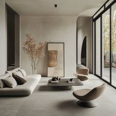a modern living room with white furniture and large glass doors leading to an outside patio