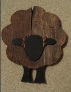 a piece of wood that has been made to look like a sheep