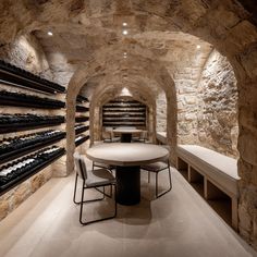 a wine cellar with tables and chairs in it