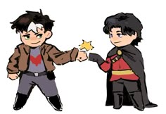 two young boys dressed in costumes, one holding a star and the other pointing at it