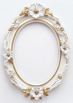 a white and gold plate with flowers on the rim is shown against a white background