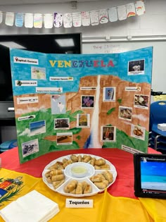 a table topped with plates of food next to a sign that says ven segura