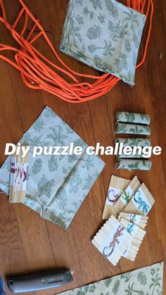 several pieces of fabric and scissors on a wooden floor with the words diy puzzle challenge