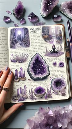 an open book with purple crystals on it