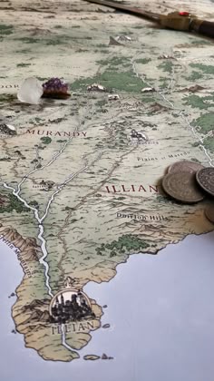 a close up of a map with coins on it