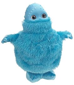 a blue stuffed animal with one eye open and two hands out in the air, standing upright