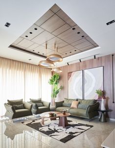 a living room filled with furniture and a large painting hanging on the wall above it