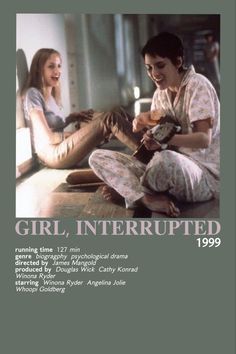 two women sitting on the floor talking to each other