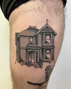 a black and white photo of a house on the thigh with an arrow in front of it