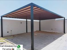 an empty building with a metal roof in the foreground and a sign that says call 0445427232 for price