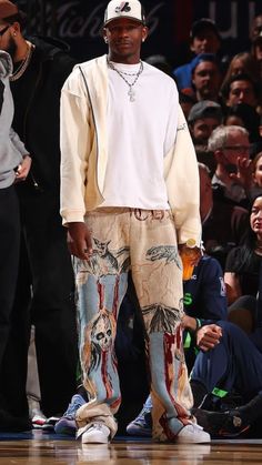 NBA basketball wallpaper background of Minnesota Timberwolves star Anthony Edwards on the sidelines of a game in a swag style outfit