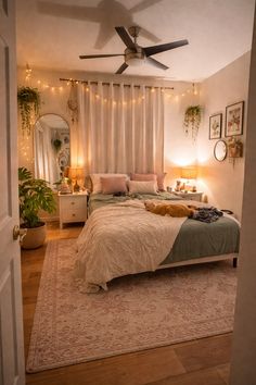 a bed room with a neatly made bed and a ceiling fan