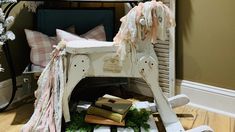 a white rocking horse with pink and green decorations