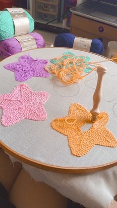 the table is decorated with colorful crochet stars