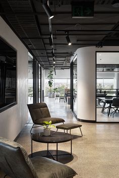 an empty room with chairs and tables in it