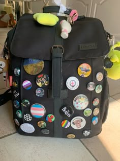Btw! I do NOT support Melanie Martinez anymore and the pin on my bag is only there for a replacement while i get more pins Pins On Bag Aesthetic, School Bag With Pins, Pin Backpack Bags, Bag With Pins Aesthetic, Messenger Bag Pins Aesthetic, Backpack With Pins And Keychains, Bag With Pins And Patches, Backpack With Patches And Pins Grunge, Buttons On Backpack