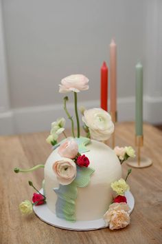 there is a cake with flowers on the table