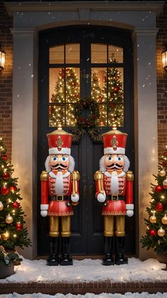 two large nutcrackers are standing in front of a door decorated for christmas