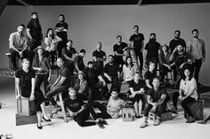 a group of people are posing for a black and white photo