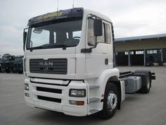 a large white truck parked in a parking lot