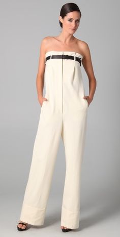 Viktor & Rolf Elegant Strapless Jumpsuits And Rompers For Spring, Solid Strapless Overall Jumpsuit For Work, Chic Strapless Sleeveless Jumpsuit For Cocktail, Spring Evening Strapless Overall Jumpsuit, Chic Cotton Strapless Jumpsuit For Spring, Luxury Chic Strapless Jumpsuit For Spring, Luxury Elegant Strapless Jumpsuit For Work, Solid Color Strapless Jumpsuit For Work, Schiaparelli Jumpsuit