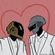 two people with helmets on standing next to each other in front of a red heart