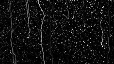 rain is falling down on the black background
