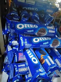 several bags of oreo cookies stacked on top of each other