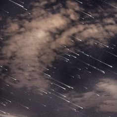 the night sky is filled with stars and clouds