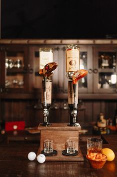 two wine glasses sitting on top of a wooden table