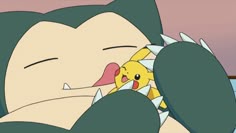 pikachu is sleeping with her head on the pillow