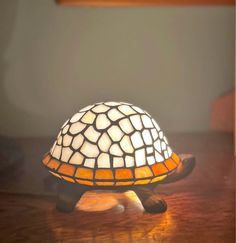 a lamp sitting on top of a wooden table