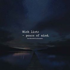 a person sitting on a dock at night with the words wish list peace of mind