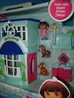 a toy house with dora the explorer and other toys