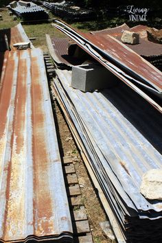 several metal sheets are laying on the ground