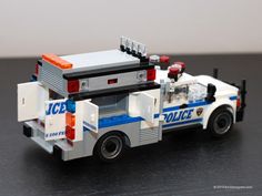 a lego police car is shown on a table