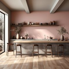 a kitchen with pink walls and wooden flooring next to an open window that looks out onto the outdoors
