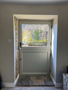 Hallway with real stone floor and a pebble grey timber stable door.